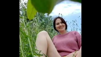 Angela, a mature woman, in a chamomile field has a sensual experience that includes self-pleasure, urination and the removal of a wasp.